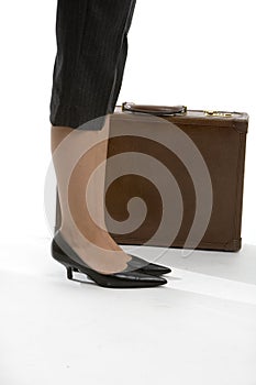 Woman's feet with brief case