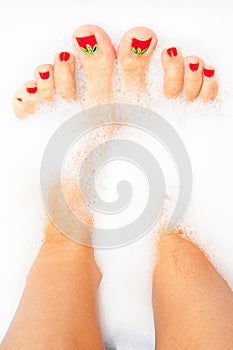 Woman's feet in foam bath