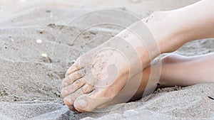 Woman's feet in sand