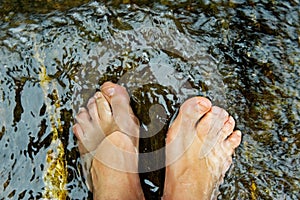 Woman's feet underwater