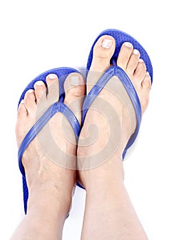 Woman's Feet Wearing Blue Flop Flops