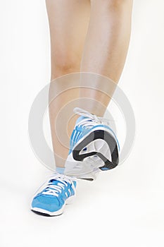 Woman's feet wearing sports trainers