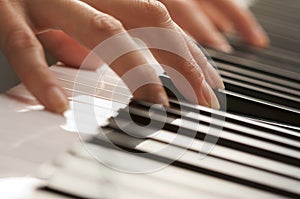 Woman's Fingers on Digital Piano Keys