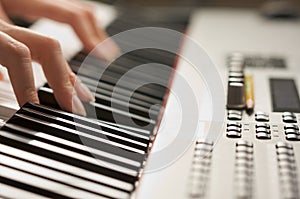 Woman's Fingers on Digital Piano Keys