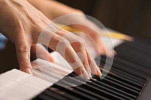 Woman's Fingers on Digital Piano Keys