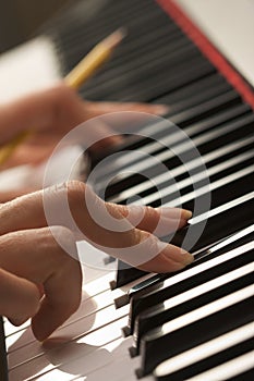 Woman's Fingers on Digital Piano Keys