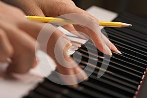 Woman's Fingers on Digital Piano Keys