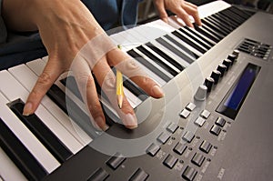 Woman's Fingers on Digital Piano Keys