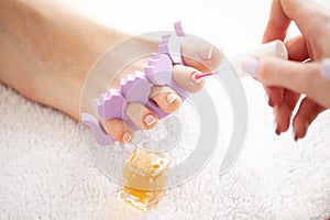 Woman`s french pedicure. Close Up Woman Hands Touching Long Legs