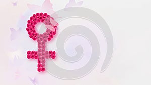 Woman\'s gender symbol with butterfly, International Womans day concept