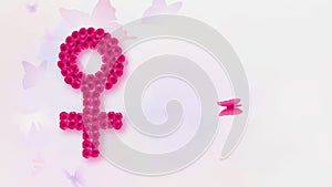 Woman\'s gender symbol with butterfly, International Womans day concept