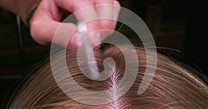 Woman`s hair being combed