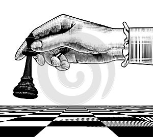 Woman`s hand with a black king chess piece