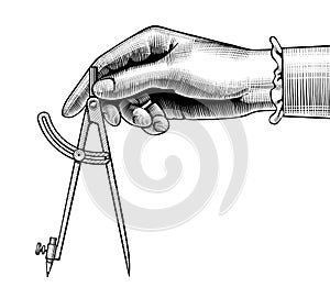 Woman`s hand with a compass for drawing