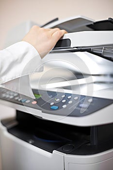 Woman's hand with copier photo