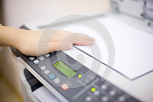 Woman's hand with copier photo