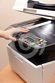 Woman's hand with copier