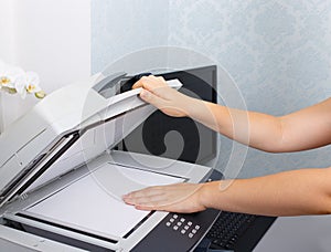 Woman's hand with copier