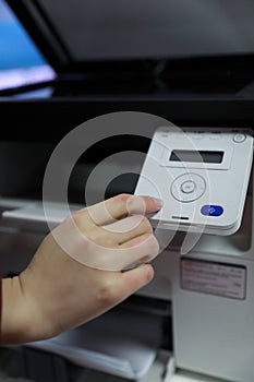 Woman s hand with copier,Multifunction Printer Start