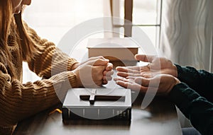 Woman`s hand with cross .Concept of hope, faith, christianity, religion, church and pray to God. on the table