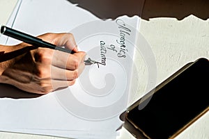 Handwritten text on a white sheet of paper