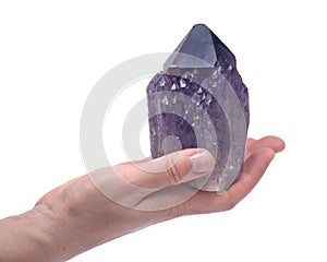 Woman`s hand holding Ametrine lightbrary point from Bolivia