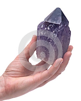 Woman`s hand holding Ametrine lightbrary point from Bolivia photo