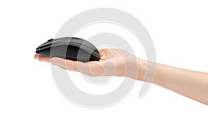 Woman`s hand holding black computer mouse isolated on white
