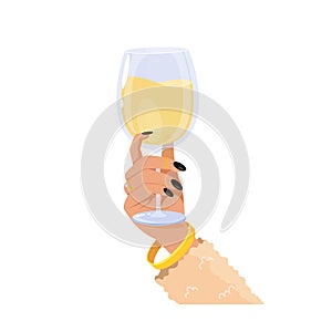 A woman\'s hand holding a champagne glass