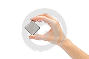 Woman`s hand holding computer processor. Isolated on white