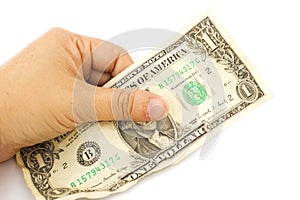 Woman's hand holding a Crumpled One Dollar bill on white backgro