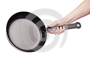 Woman's hand holding a frying pan