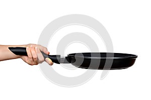 Woman's hand holding a frying pan