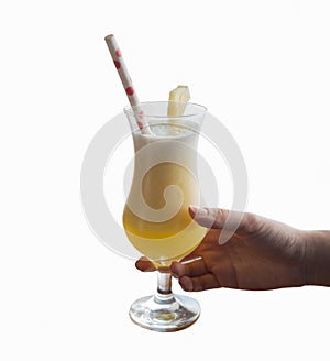 Woman`s hand holding glass of coctail