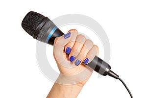 Woman's hand holding a microphone
