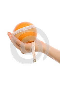 Woman's hand holding orange