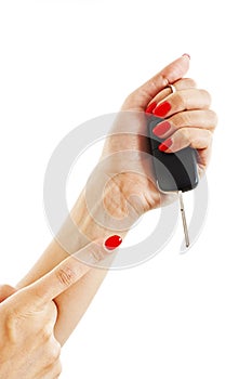 A woman's hand holds car keys