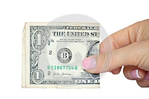 Woman's hand holds one dollars on a white background ,business