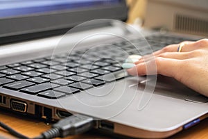 Woman`s hand on keyboard