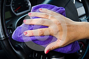 Woman's hand with microfiber cloth