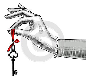 Woman`s hand with old key