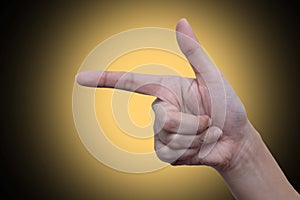 Woman`s hand pointing to something isolated on gradient background. Hand language concept. Communication concept