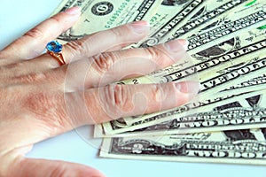 Woman's hand purchasing the ring with topaz