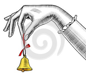 Woman`s hand ringing retro bell