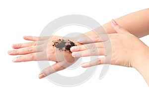 Woman& x27;s hand with scrub coffee grounds on skin hand and arm, bea