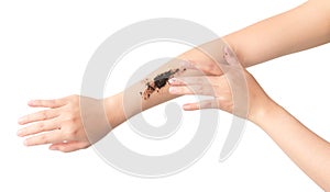 Woman& x27;s hand with scrub coffee grounds on skin hand and arm, bea