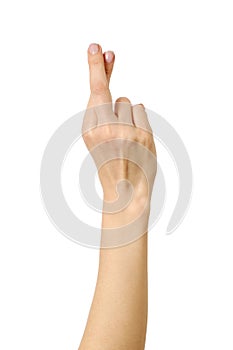 Woman`s hand showing crossed fingers lie symbol