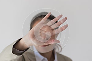 Woman`s hand showing reject, stop, break, pause gesture