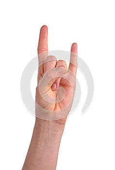 Woman`s hand showing Sign of the hornsisolated over white photo