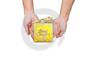 Woman's hand with a small gold gift box